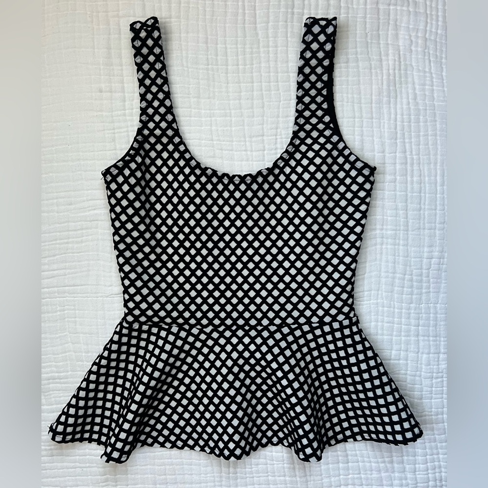 Bebe peplum sleeveless top -Size XS -Black and white geometric pattern